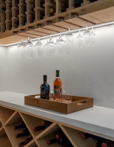 A wine cellar with a tray of wine glasses.